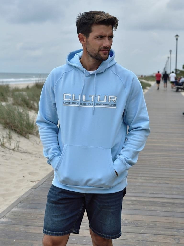 CULTUR blue mist microfiber performance hoodie with kangaroo pocket and logo on a man at the beach boardwalk.