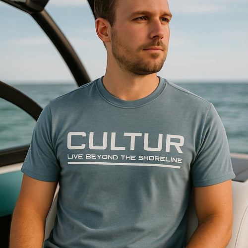 CULTUR stonewash blue tri-blend t-shirt with white logo print, crew neck, and athletic fit.