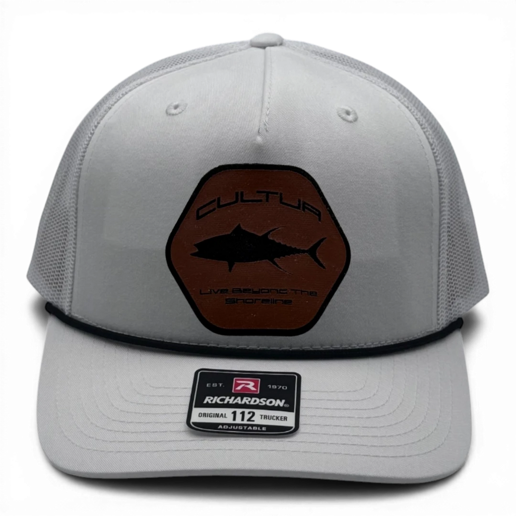 CULTUR white trucker hat with a hexagonal brown patch featuring a black tuna silhouette and