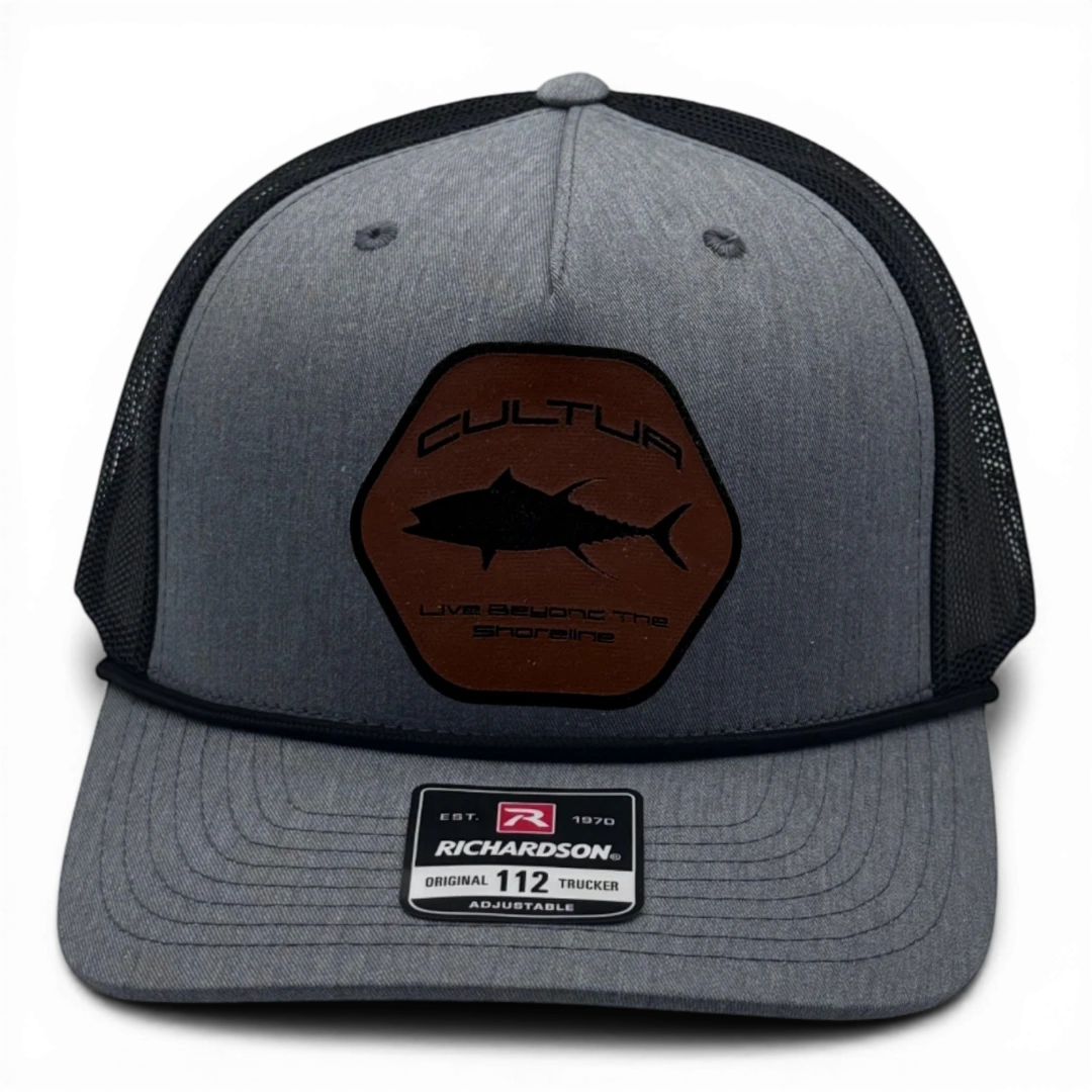 CULTUR grey trucker hat with black mesh back and brown hexagonal patch featuring a tuna silhouette and text.