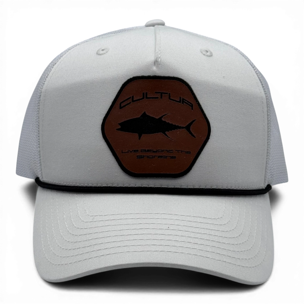 CULTUR white trucker hat with a brown hexagonal patch featuring a black tuna silhouette and text.
